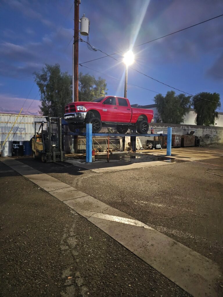 Truck on a lift in the Sun West shop yard