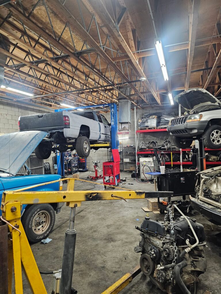 Vehicle on a lift for transmission service at Sun West