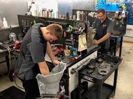 Technicians working in an automotive repair workshop